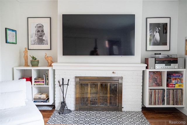 1036 Irving Ave, Royal Oak, MI 48067 - living room featuring a fireplace and wood finished floors