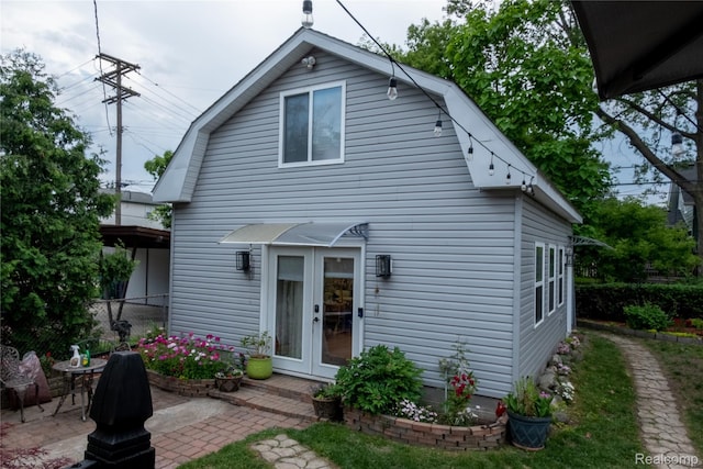 1036 Irving Ave, Royal Oak, MI 48067 - rear view of property featuring a gambrel roof, french doors, and a patio