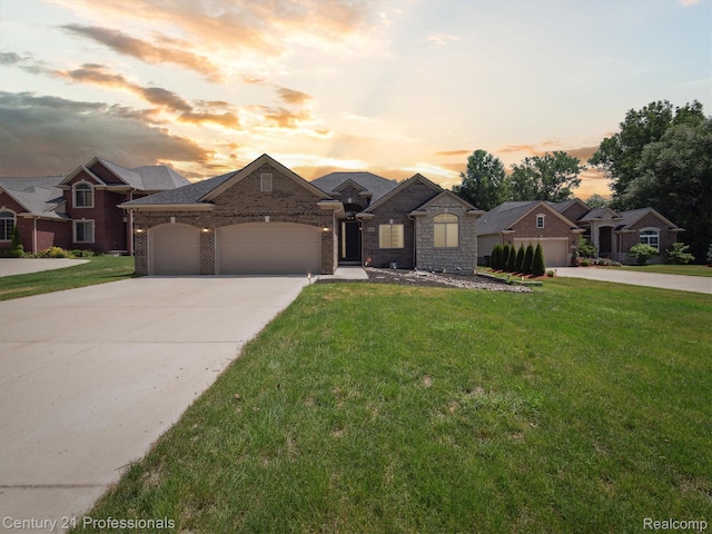 2655 Devondale Rd, Rochester Hills, MI 48309 - french country inspired facade featuring concrete driveway, a garage, a yard, and brick siding