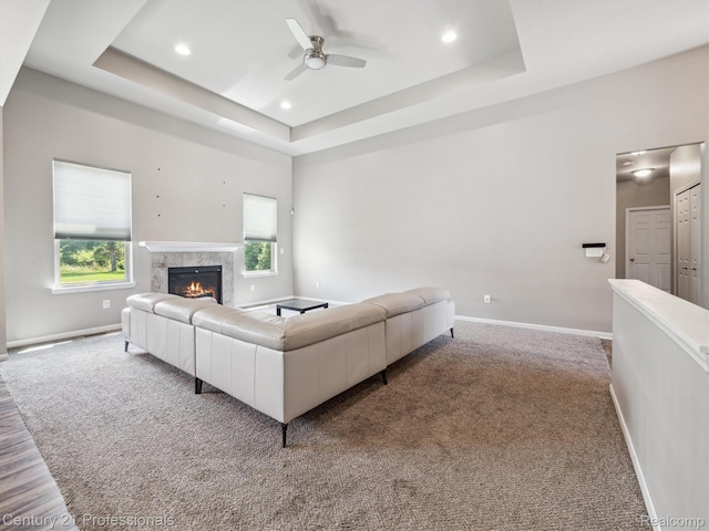 2655 Devondale Rd, Rochester Hills, MI 48309 - living area with a ceiling fan, a tray ceiling, a high end fireplace, carpet, and recessed lighting