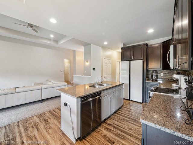 2655 Devondale Rd, Rochester Hills, MI 48309 - kitchen with stainless steel appliances, light wood-type flooring, a ceiling fan, open floor plan, and an island with sink