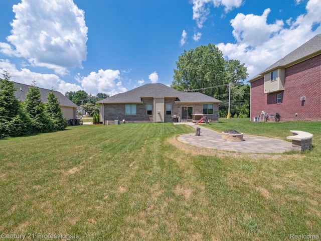 2655 Devondale Rd, Rochester Hills, MI 48309 - rear view of property featuring an outdoor fire pit, a yard, a patio area, and brick siding