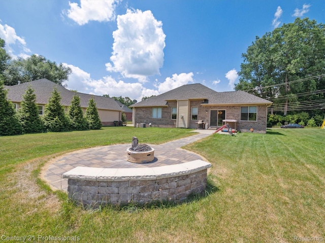 2655 Devondale Rd, Rochester Hills, MI 48309 - back of property with an outdoor fire pit, brick siding, a lawn, and a patio area