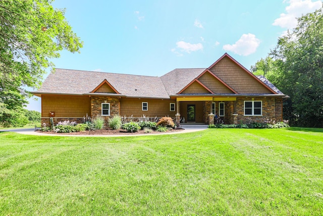 9434 84th St SE, Alto, MI 49302 - craftsman-style house featuring stone siding and a front yard