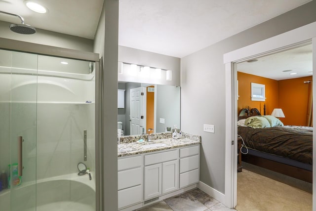 9434 84th St SE, Alto, MI 49302 - full bathroom featuring connected bathroom, a stall shower, and vanity