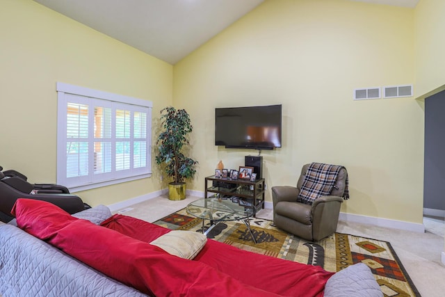 9434 84th St SE, Alto, MI 49302 - carpeted living area with high vaulted ceiling and baseboards