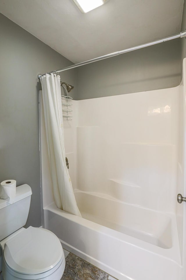 9434 84th St SE, Alto, MI 49302 - full bathroom with toilet and shower / bath combo with shower curtain