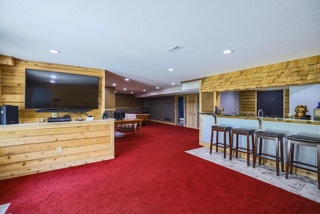 9434 84th St SE, Alto, MI 49302 - carpeted living area featuring recessed lighting and wooden walls