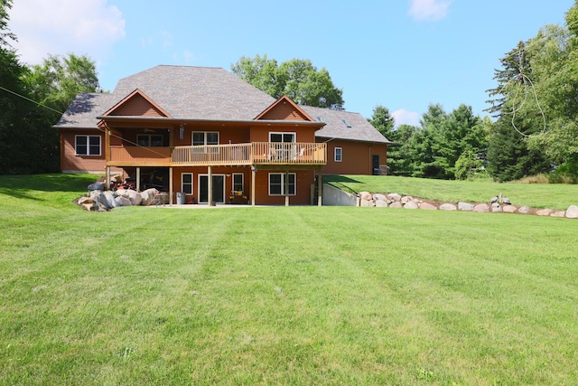 9434 84th St SE, Alto, MI 49302 - back of house featuring a lawn, a deck, a patio, and roof with shingles