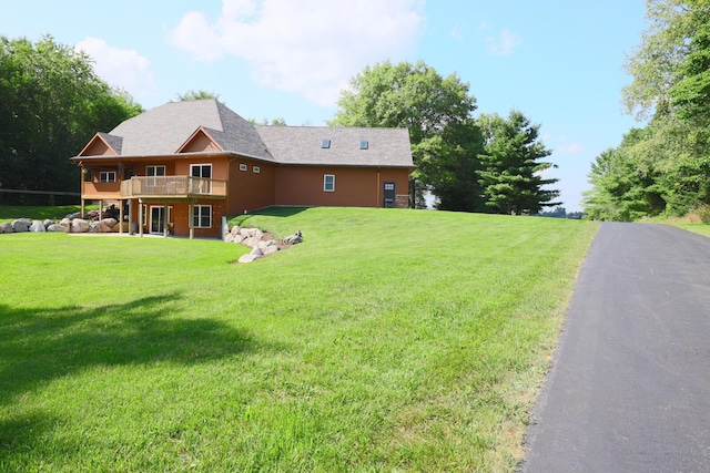 9434 84th St SE, Alto, MI 49302 - view of green lawn with a deck