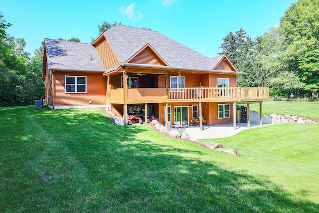 9434 84th St SE, Alto, MI 49302 - rear view of property with a patio area, a yard, a wooden deck, and a shingled roof