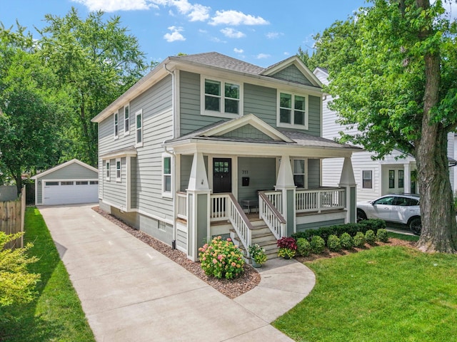 711 N Alexander Ave, Royal Oak, MI 48067 - american foursquare style home with covered porch, an outbuilding, a garage, and a front lawn