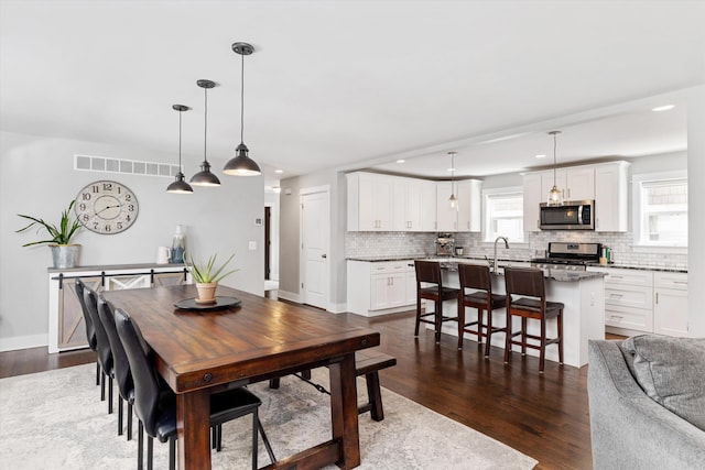 711 N Alexander Ave, Royal Oak, MI 48067 - dining space with dark wood-style floors and recessed lighting