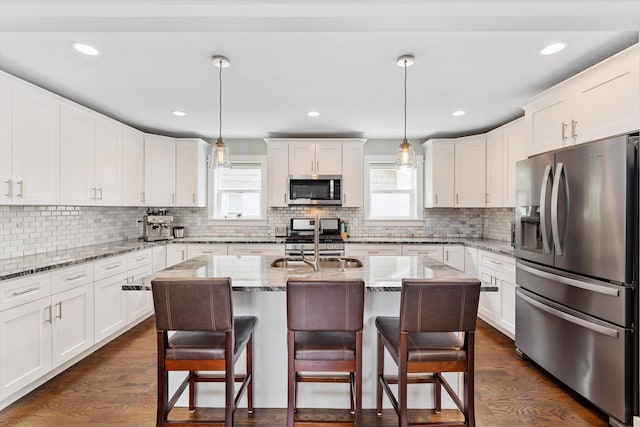 711 N Alexander Ave, Royal Oak, MI 48067 - kitchen with stainless steel appliances, plenty of natural light, white cabinetry, and recessed lighting