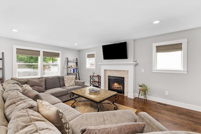 711 N Alexander Ave, Royal Oak, MI 48067 - living room with wood finished floors, a glass covered fireplace, and recessed lighting