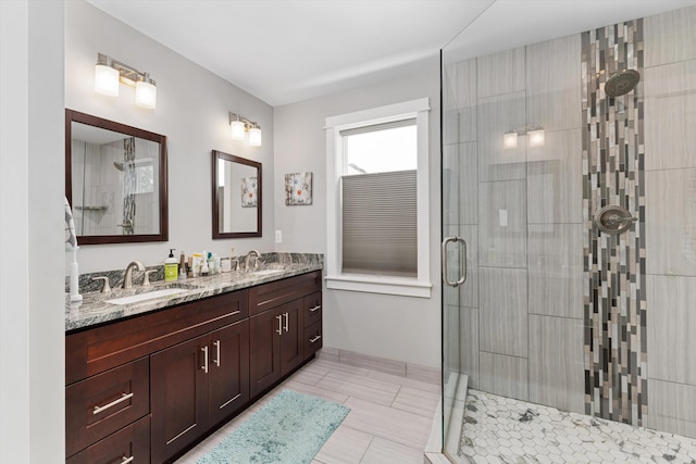 711 N Alexander Ave, Royal Oak, MI 48067 - bathroom featuring a stall shower, double vanity, and tile patterned flooring