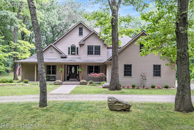 359 High Bluffs Dr, Ortonville, MI 48462 - traditional-style home with covered porch, a chimney, and a front lawn