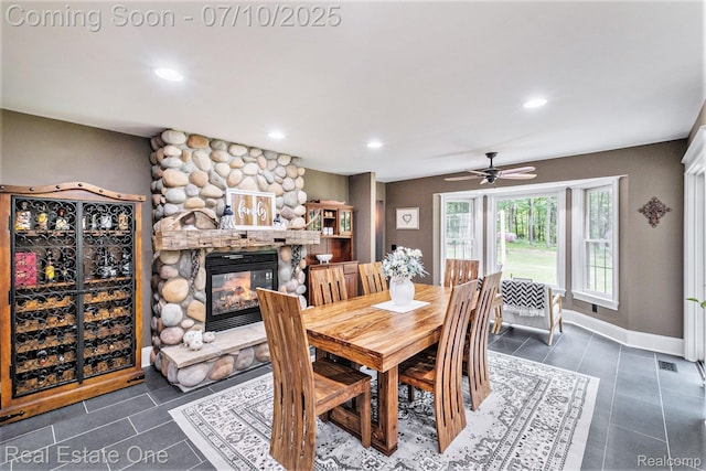 359 High Bluffs Dr, Ortonville, MI 48462 - dining area featuring recessed lighting, ceiling fan, dark tile patterned flooring, and a fireplace