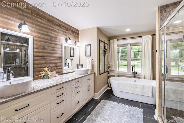 359 High Bluffs Dr, Ortonville, MI 48462 - bathroom with double vanity, a stall shower, rustic walls, a freestanding tub, and tile patterned flooring