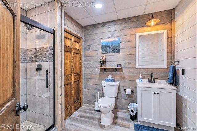 359 High Bluffs Dr, Ortonville, MI 48462 - full bathroom with vanity, a shower stall, wood finished floors, and wood walls