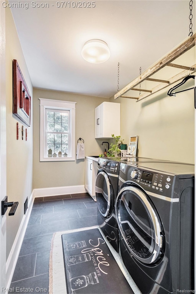 359 High Bluffs Dr, Ortonville, MI 48462 - laundry area featuring cabinet space and washing machine and dryer