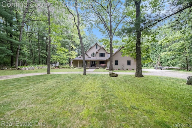 359 High Bluffs Dr, Ortonville, MI 48462 - view of front of house with a front lawn and curved driveway