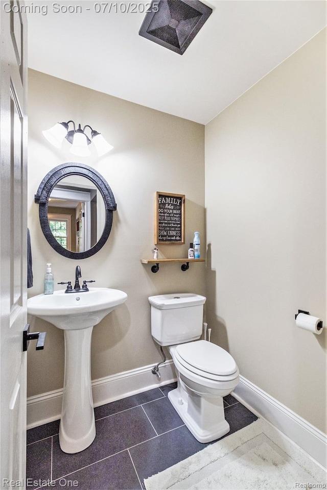 359 High Bluffs Dr, Ortonville, MI 48462 - bathroom featuring toilet and tile patterned floors