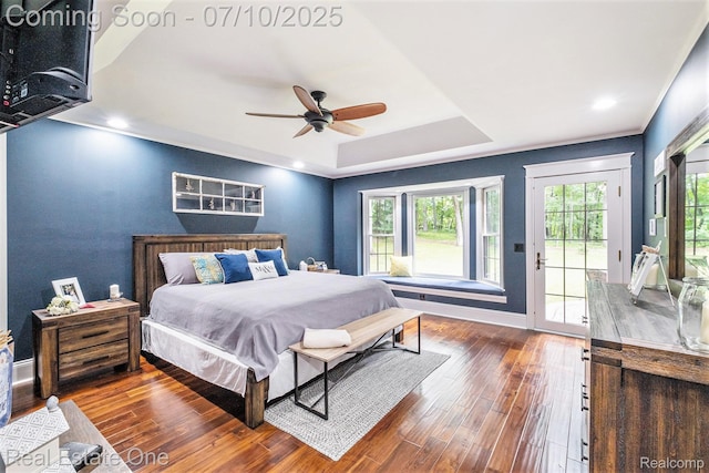 359 High Bluffs Dr, Ortonville, MI 48462 - bedroom featuring access to exterior, wood finished floors, a tray ceiling, and a ceiling fan