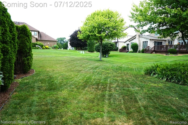 19230 Augusta Ct, Livonia, MI 48152 - view of green lawn with a deck