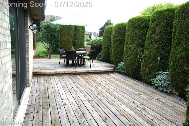 19230 Augusta Ct, Livonia, MI 48152 - wooden deck featuring outdoor dining area