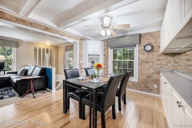 38683 Bayside Ct Unit 118, Clinton Township, MI 48038 - dining room featuring light wood-style floors, ceiling fan, beamed ceiling, and brick wall