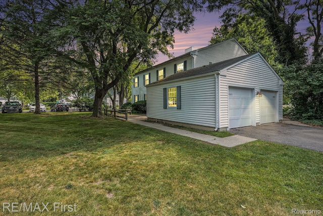 38683 Bayside Ct Unit 118, Clinton Township, MI 48038 - property exterior at dusk with asphalt driveway, a garage, and a lawn