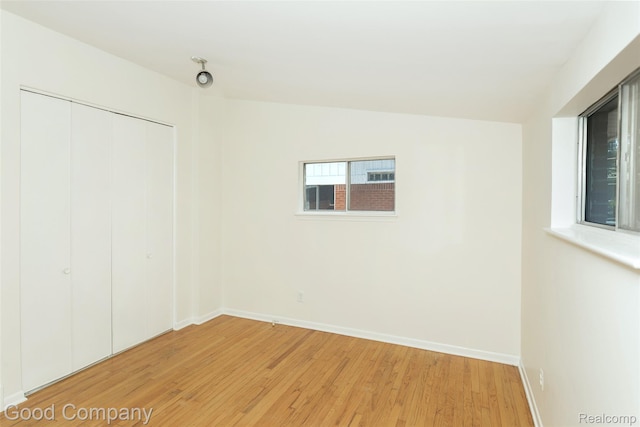 2931 N Main St, Royal Oak, MI 48073 - unfurnished bedroom with light wood-style floors and a closet