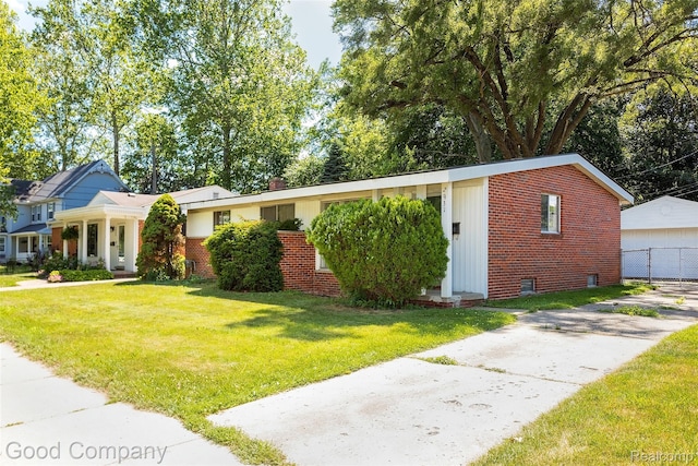 2931 N Main St, Royal Oak, MI 48073 - view of front of home with brick siding, a front lawn, and a garage