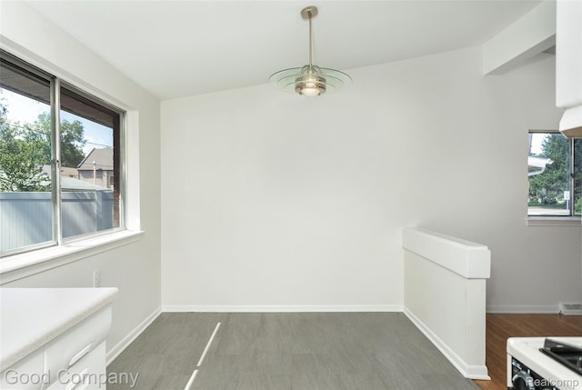 2931 N Main St, Royal Oak, MI 48073 - unfurnished dining area featuring wood finished floors and baseboards