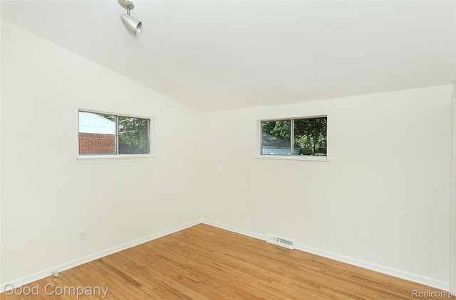 2931 N Main St, Royal Oak, MI 48073 - empty room with light wood-type flooring and lofted ceiling