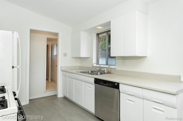 2931 N Main St, Royal Oak, MI 48073 - kitchen with stainless steel dishwasher, freestanding refrigerator, stove, white cabinets, and light countertops