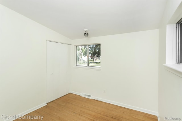 2931 N Main St, Royal Oak, MI 48073 - empty room featuring light wood-type flooring and lofted ceiling