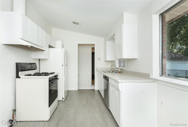 2931 N Main St, Royal Oak, MI 48073 - kitchen with white range with gas stovetop, stainless steel dishwasher, light countertops, lofted ceiling, and white cabinetry