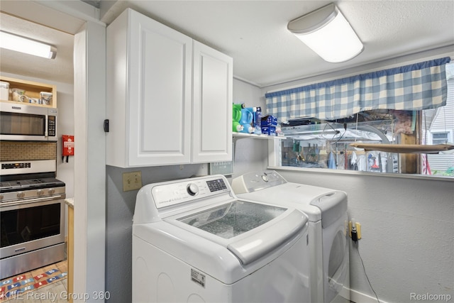 204 W Caroline St, Bellevue, MI 49021 - laundry room with washer and clothes dryer and cabinet space