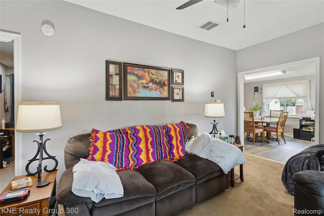 204 W Caroline St, Bellevue, MI 49021 - living area with a ceiling fan and carpet