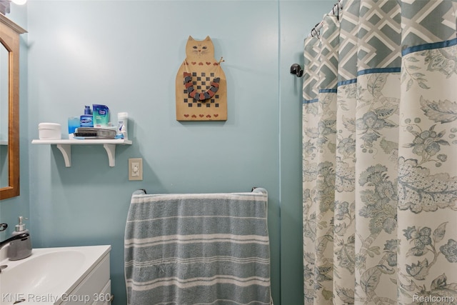 204 W Caroline St, Bellevue, MI 49021 - full bathroom featuring vanity and curtained shower