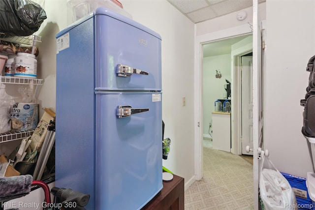 204 W Caroline St, Bellevue, MI 49021 - kitchen featuring freestanding refrigerator and a paneled ceiling