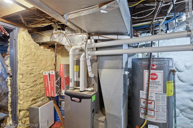 204 W Caroline St, Bellevue, MI 49021 - utility room with gas water heater