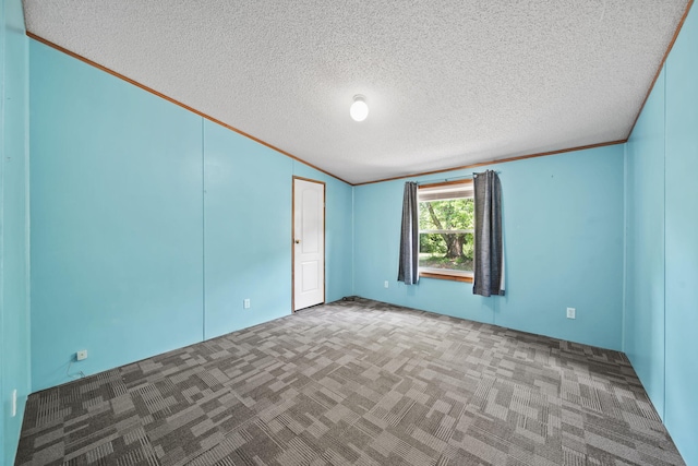 8756 Portage Lake Rd, Munith, MI 49259 - unfurnished room featuring carpet flooring, ornamental molding, a textured ceiling, and lofted ceiling
