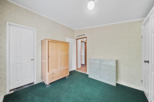8756 Portage Lake Rd, Munith, MI 49259 - unfurnished bedroom featuring dark carpet, a textured ceiling, and ornamental molding