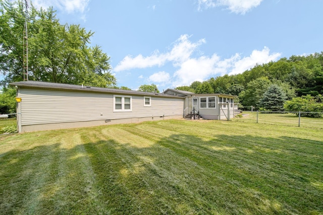 8756 Portage Lake Rd, Munith, MI 49259 - rear view of property with entry steps and crawl space