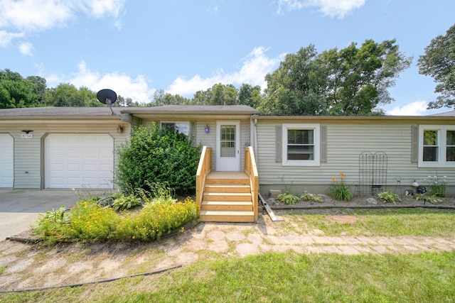8756 Portage Lake Rd, Munith, MI 49259 - view of front of house featuring a garage and driveway