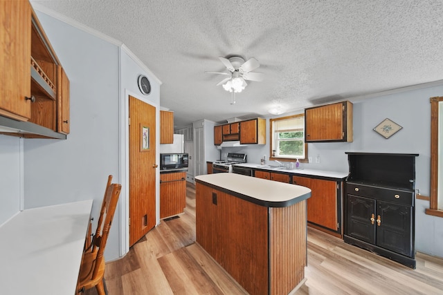 8756 Portage Lake Rd, Munith, MI 49259 - kitchen featuring black microwave, white gas stove, light wood-style flooring, ceiling fan, and a textured ceiling