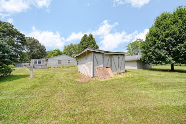 8756 Portage Lake Rd, Munith, MI 49259 - view of green lawn with an outbuilding